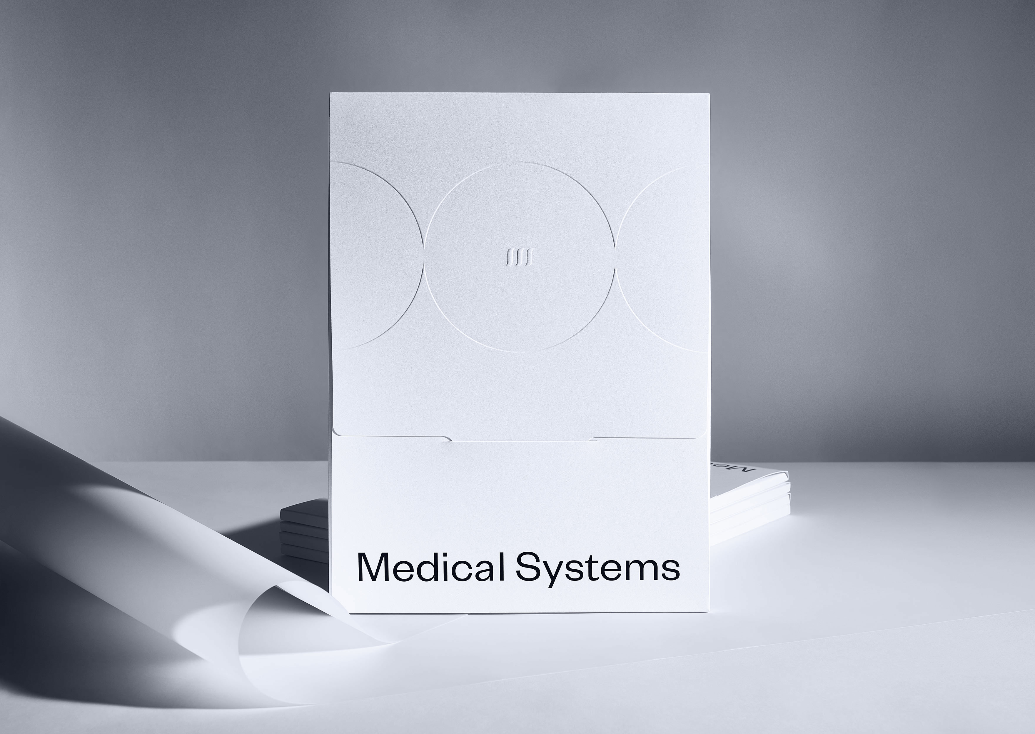 medical systems branding folders standing kommigraphics