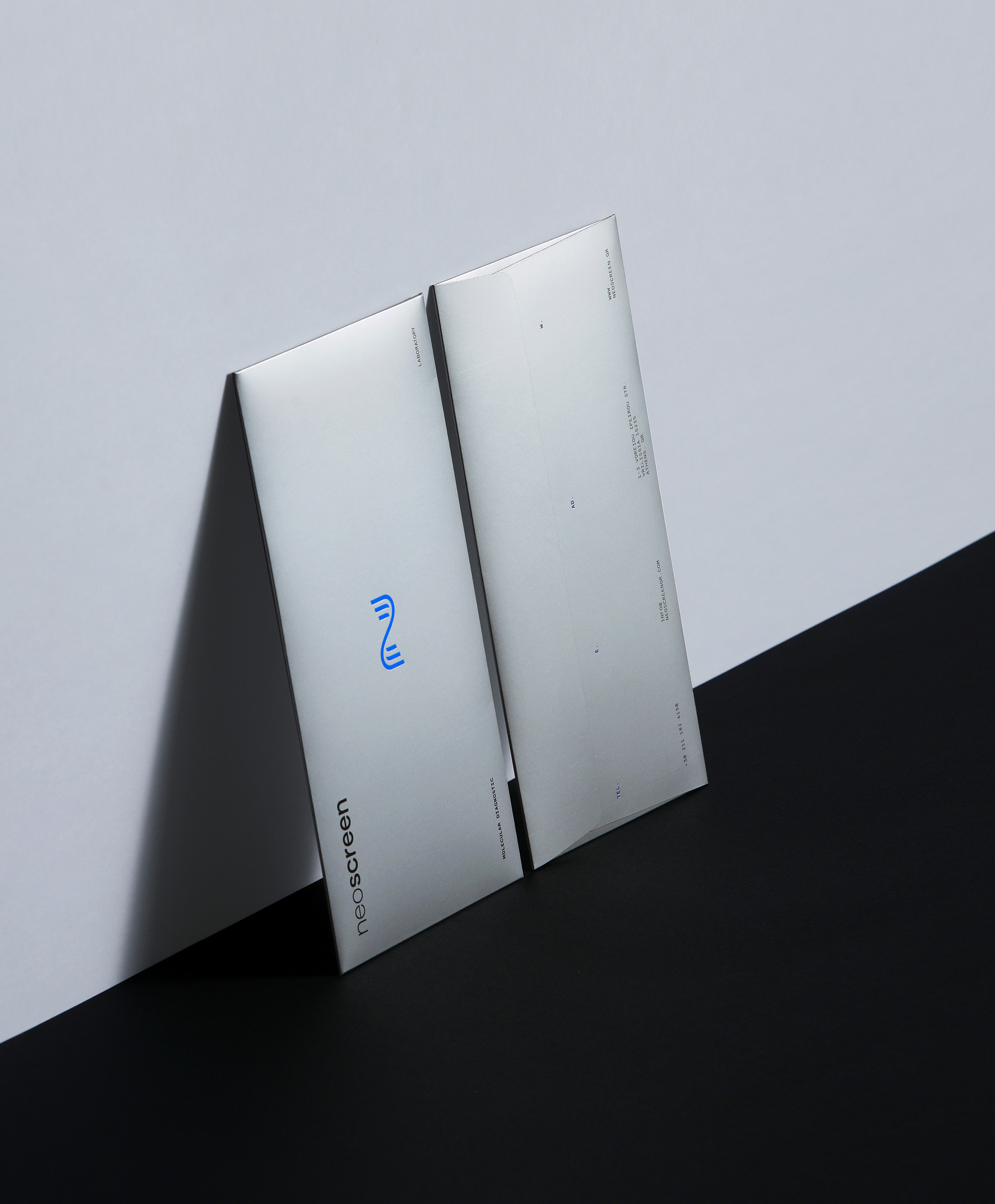 neoscreen branding silver envelopes vertical kommigraphics